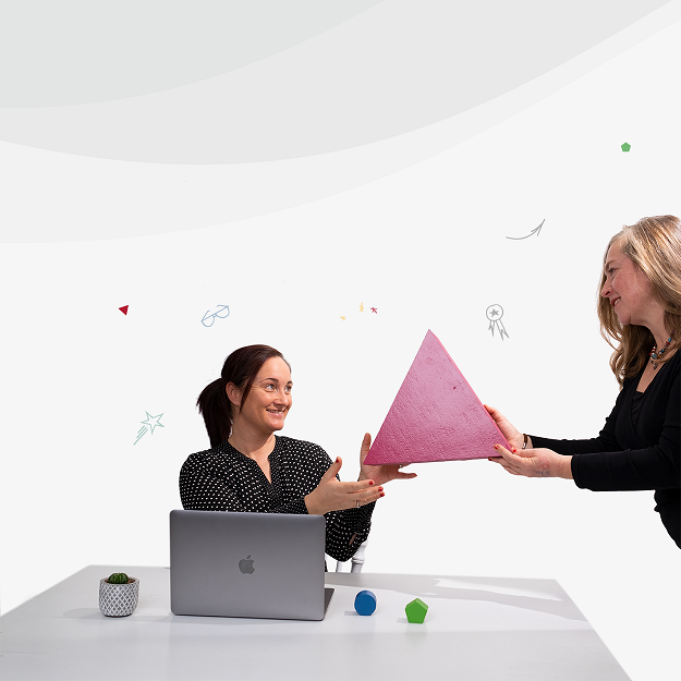 Two women hold sharing a triangle block showing commitment level on splitting equity